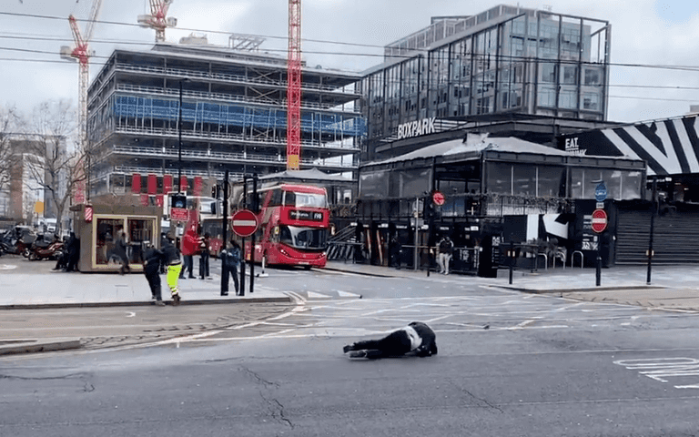 Shocking moment people get thrown into traffic by strong winds during Storm Eunice Shocking moment people get thrown into traffic by strong winds during Storm Eunice