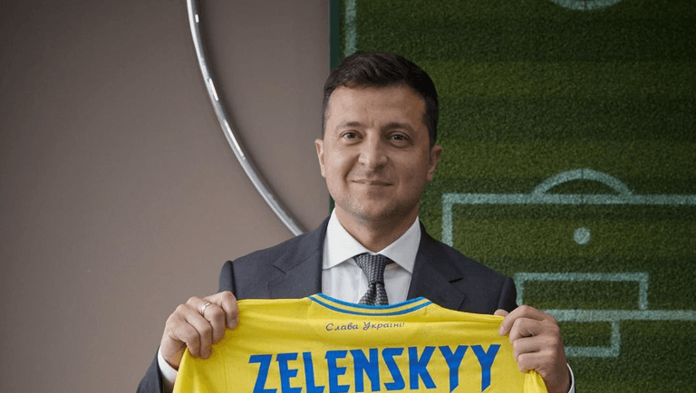 No, Ukrainian President Zelenskyy did not hold up a jersey with a Nazi symbol on No, Ukrainian President Zelenskyy did not hold up a jersey with a Nazi symbol on