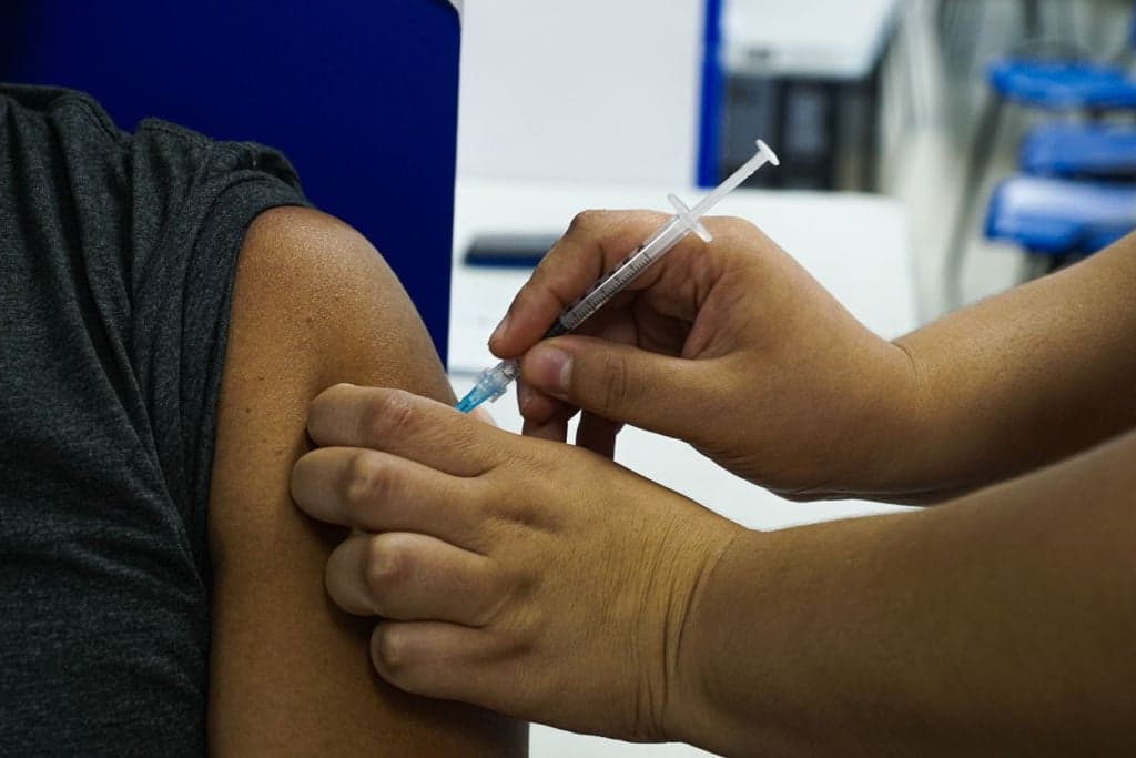 Man hiding true identity for years outed by his covid vaccine