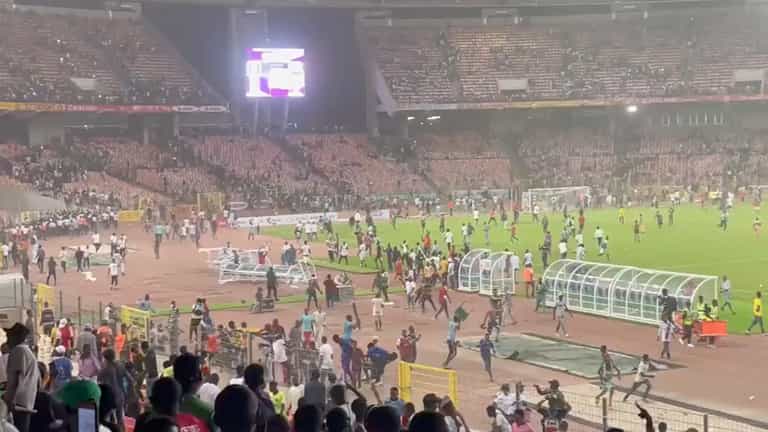 Nigeria fans storm pitch in anger after World Cup qualification failure Nigeria fans storm pitch in anger after World Cup qualification failure