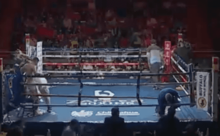 Boxing referee stretchered out of ring after being hit by fighter Boxing referee stretchered out of ring after being hit by fighter