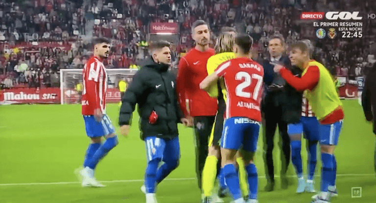 Sporting Gijon players attack Real Oviedo goalkeeper Joan Femenias Sporting Gijon players attack Real Oviedo goalkeeper Joan Femenias