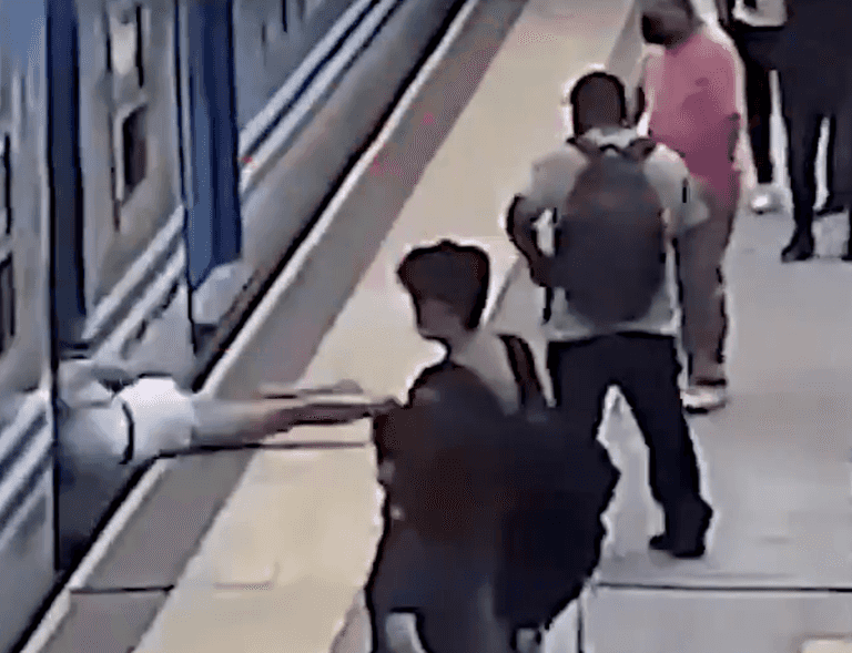 Shocking moment woman faints, falls under moving train and miraculously survives Shocking moment woman faints, falls under moving train and miraculously survives