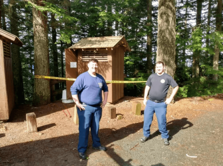 Woman rescued after falling into vault toilet trying to retrieve phone using dog leash as harness Woman rescued after falling into vault toilet trying to retrieve phone using dog leash as harness