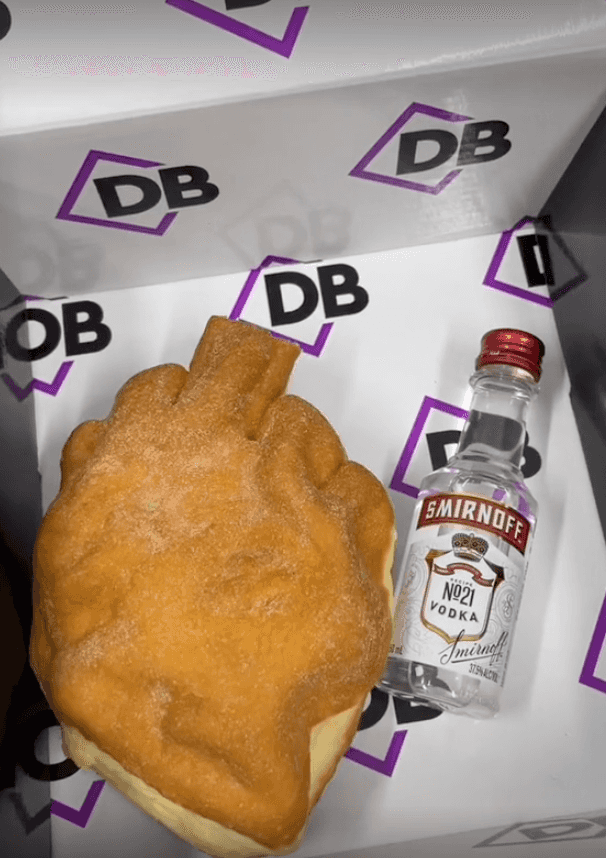 Bakery sends Amber Heard a severed finger cake and vodka bottle – and it does not go down well Bakery sends Amber Heard a severed finger cake and vodka bottle – and it does not go down well