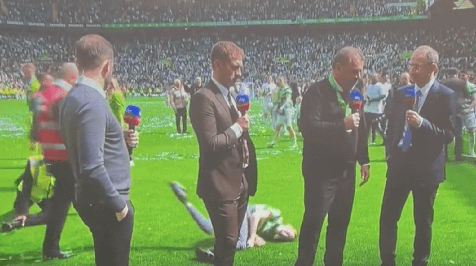 Celtic pitch invader spectacularly floored by steward during live interview