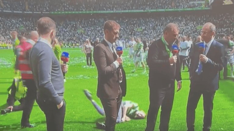 Celtic pitch invader spectacularly floored by steward during live interview Celtic pitch invader spectacularly floored by steward during live interview