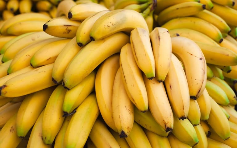 Man peels bananas before weighing them to save money Man peels bananas before weighing them to save money