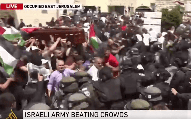 Shocking scenes as Israeli forces beat crowds carrying the casket of killed journalist Shireen Abu Akleh Shocking scenes as Israeli forces beat crowds carrying the casket of killed journalist Shireen Abu Akleh