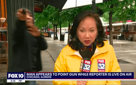 Shocking moment man appears to pull ‘a gun’ on live TV crew during report on gun violence Shocking moment man appears to pull ‘a gun’ on live TV crew during report on gun violence