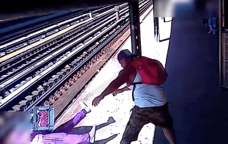 Horrific moment homeless woman thrown on to tracks by man who argued with her Horrific moment homeless woman thrown on to tracks by man who argued with her