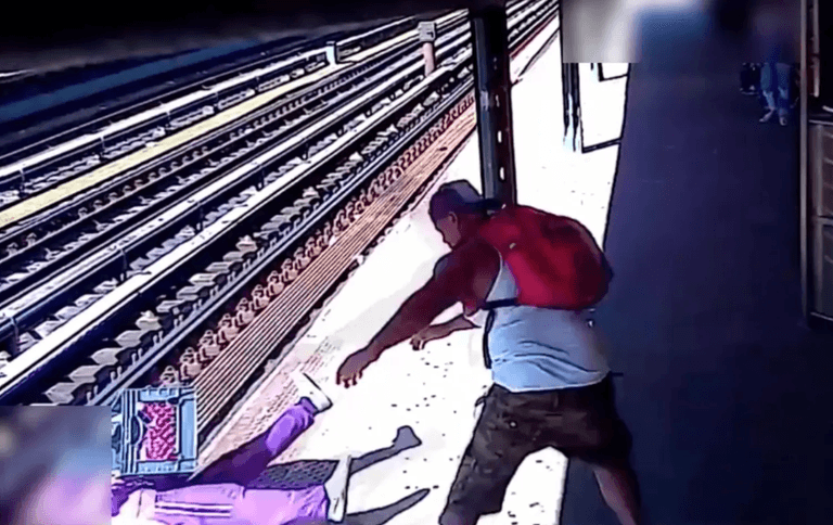 Horrific moment homeless woman thrown on to tracks by man who argued with her Horrific moment homeless woman thrown on to tracks by man who argued with her