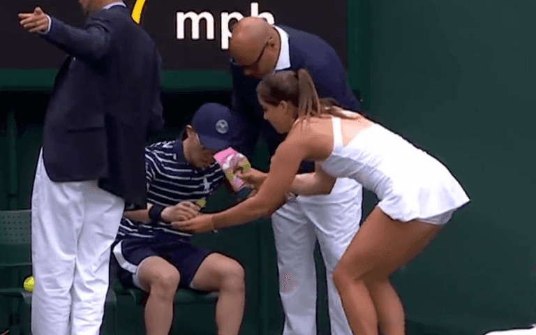 Heartwarming moment Wimbledon match halted as Brit star rushes to ill ball boy – gives him Percy Pigs Heartwarming moment Wimbledon match halted as Brit star rushes to ill ball boy – gives him Percy Pigs