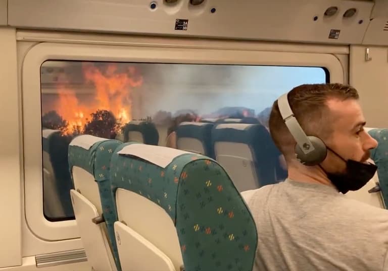 Apocalyptic scenes as train grinds to a halt in the middle of blazing wildfires Apocalyptic scenes as train grinds to a halt in the middle of blazing wildfires