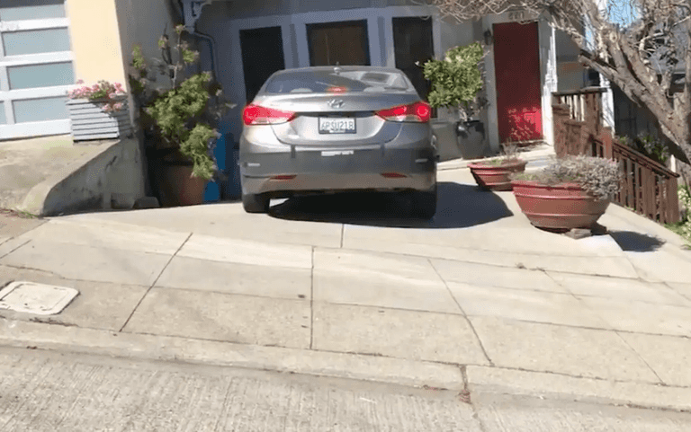 Couple shocked after being fined £1,200 for parking on own driveway Couple shocked after being fined £1,200 for parking on own driveway