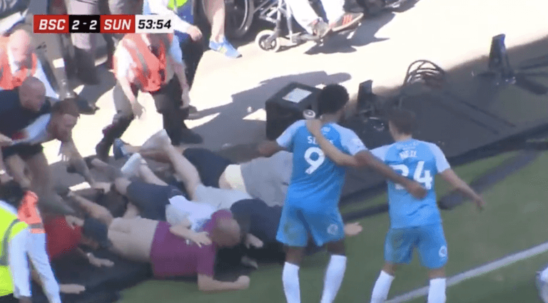 Sunderland fans fall over advertising board celebrating goal against Bristol City Sunderland fans fall over advertising board celebrating goal against Bristol City