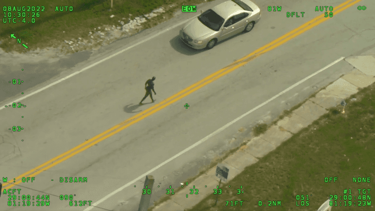 Naked offender armed with a machete tries to rob man of his clothing in incident captured on CCTV Naked offender armed with a machete tries to rob man of his clothing in incident captured on CCTV