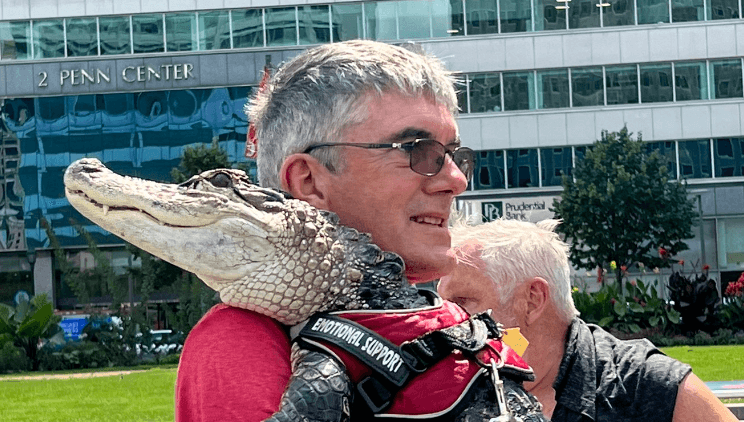 People are losing it after man is spotted with an emotional support alligator People are losing it after man is spotted with an emotional support alligator
