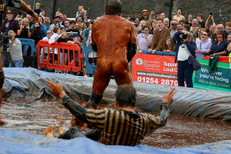 Thousands of revellers descend on pub garden as ‘world gravy wrestling championships’ return Thousands of revellers descend on pub garden as ‘world gravy wrestling championships’ return