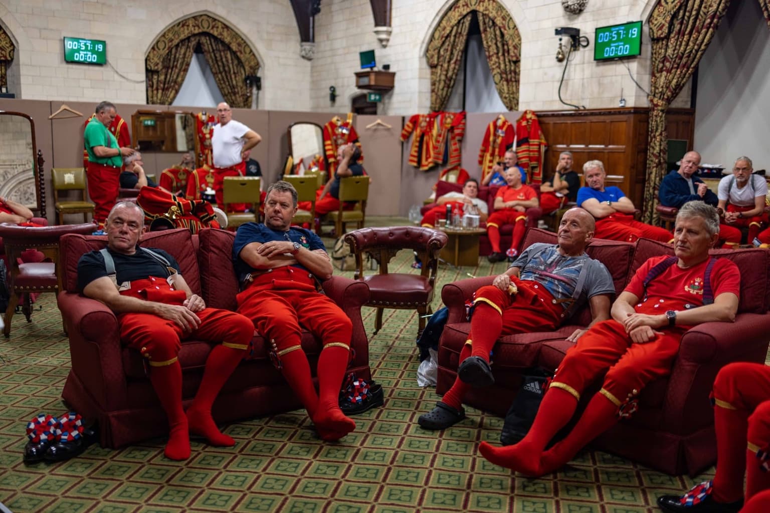 Behind-the-scenes photos show exhausted beefeaters taking a break from guarding Queen’s coffin