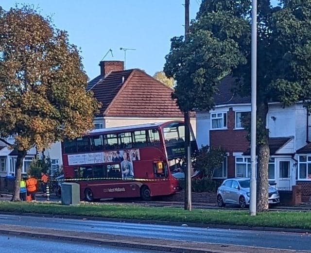 Bus driver dies after falling ill at the wheel and crashing into house garden
