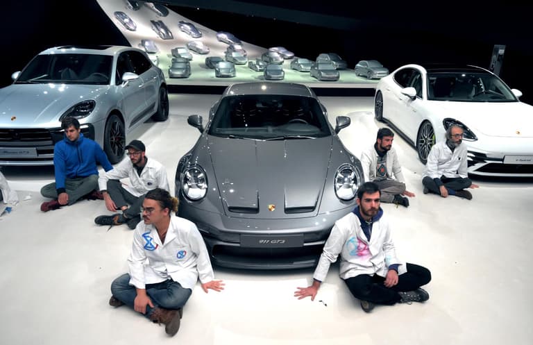 Climate activists glue themselves to floor of car dealership – but complain when staff turn off the lights and go home Climate activists glue themselves to floor of car dealership – but complain when staff turn off the lights and go home