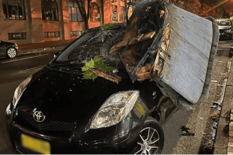 Man returns to his car to find a sofa had fallen from the sky and crushed it Man returns to his car to find a sofa had fallen from the sky and crushed it