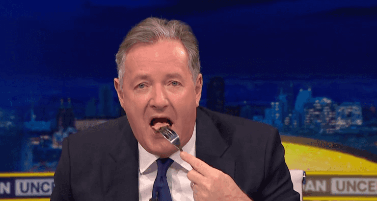 Piers Morgan eats steak in front of vegan protestor to try and make a point Piers Morgan eats steak in front of vegan protestor to try and make a point
