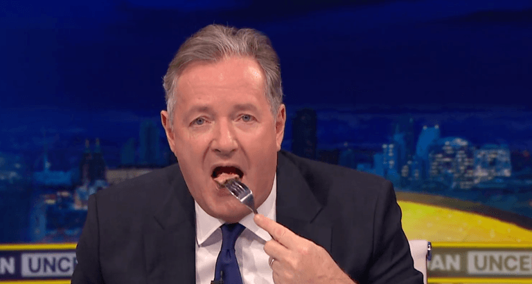 Piers Morgan eats steak in front of vegan protestor to try and make a point Piers Morgan eats steak in front of vegan protestor to try and make a point