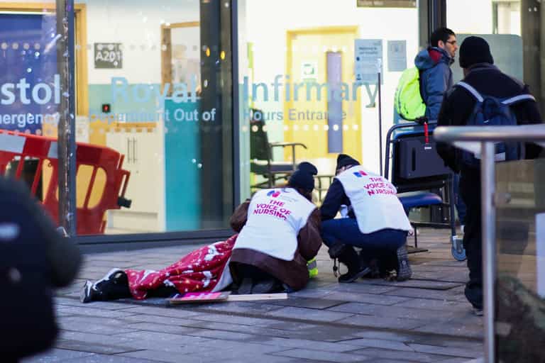Striking nurses break picket line to help man who had collapsed Striking nurses break picket line to help man who had collapsed