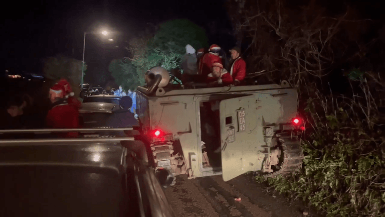Police called after tank full of Santas caused chaos by getting stuck down village lane during pub crawl Police called after tank full of Santas caused chaos by getting stuck down village lane during pub crawl