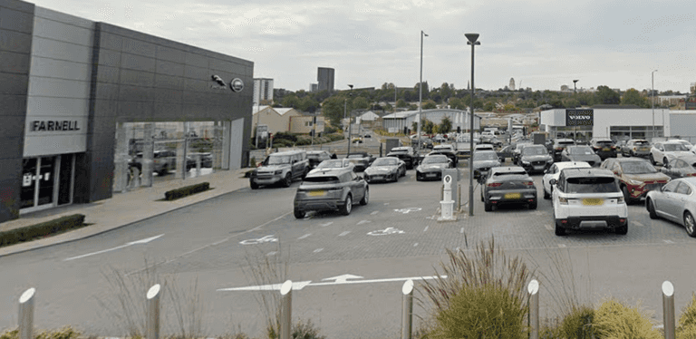 Woman and child killed after Audi crashes into Jaguar dealership in Leeds Woman and child killed after Audi crashes into Jaguar dealership in Leeds