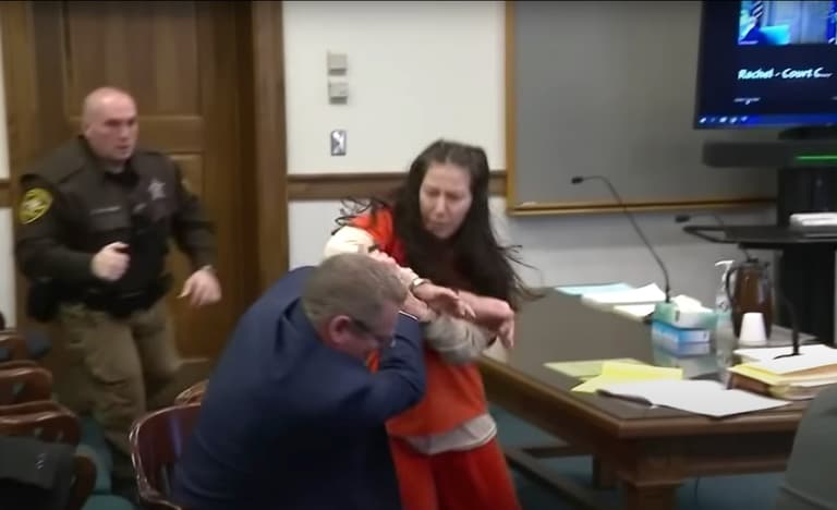 Woman accused of beheading her lover attacks lawyer in court Woman accused of beheading her lover attacks lawyer in court