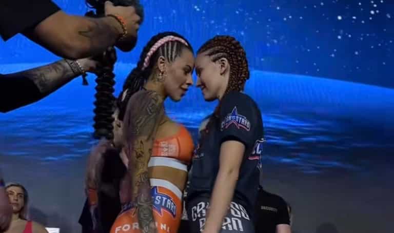 MMA fighters surprise crowd by kissing at face-off and flashing their breasts MMA fighters surprise crowd by kissing at face-off and flashing their breasts