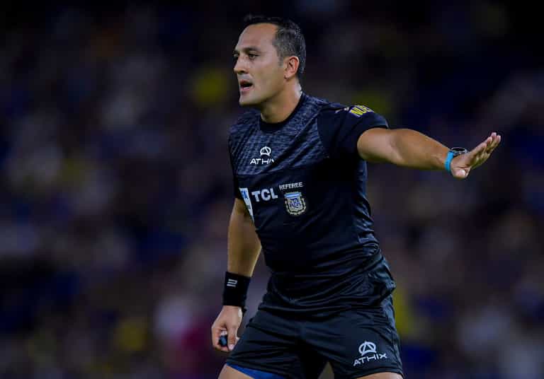 Referee gives bizarre red card to player moments after running into him Referee gives bizarre red card to player moments after running into him