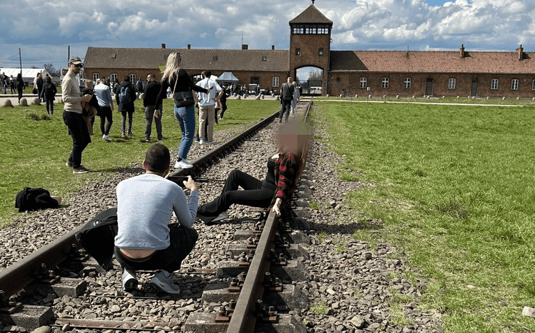 Woman sparks outrage after posing for photos on Auschwitz train tracks Woman sparks outrage after posing for photos on Auschwitz train tracks