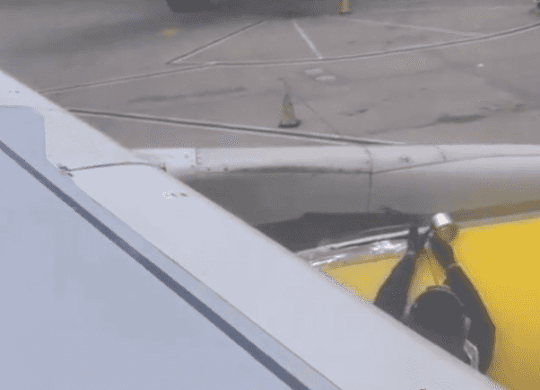 Passenger spots employee putting tape on the wing of a plane before takeoff Passenger spots employee putting tape on the wing of a plane before takeoff
