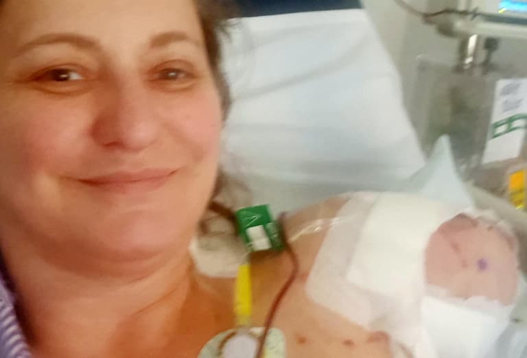 Dog owner who lost arm after American Bulldog mauled her is suing RSPCA for £200,000 Dog owner who lost arm after American Bulldog mauled her is suing RSPCA for £200,000