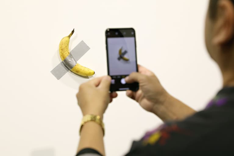 Hungry student eats famous artwork of banana duct-taped to museum wall Hungry student eats famous artwork of banana duct-taped to museum wall