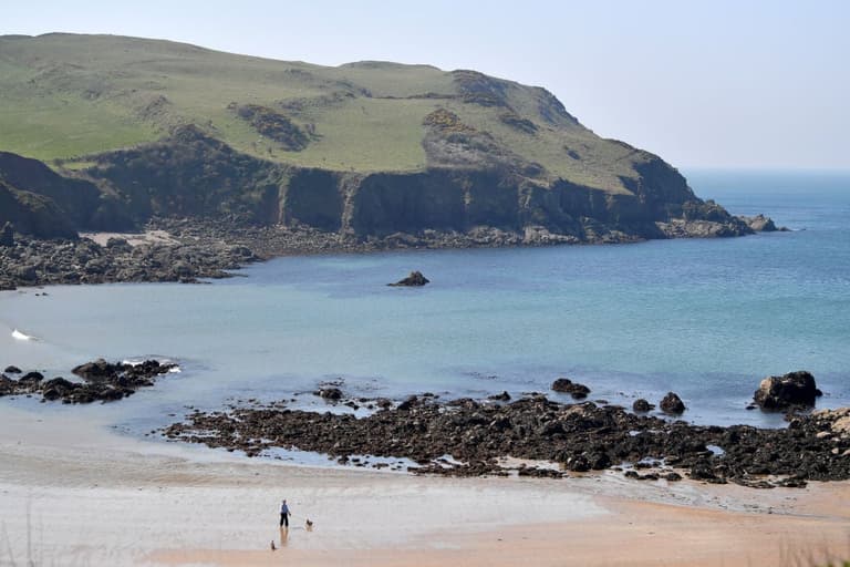 Teenager dies after falling from cliffs in Devon Teenager dies after falling from cliffs in Devon