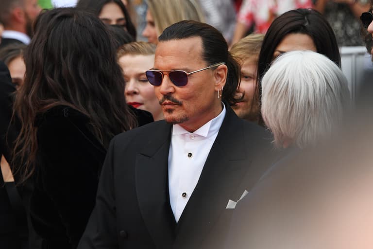 Johnny Depp holds back tears after receiving seven-minute standing ovation for his new film Johnny Depp holds back tears after receiving seven-minute standing ovation for his new film