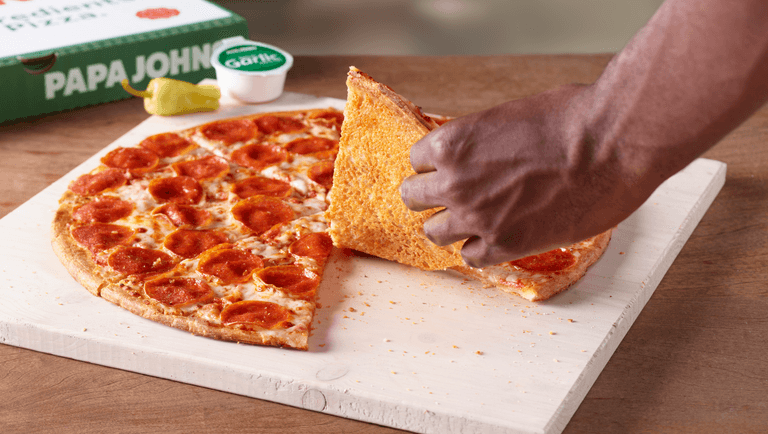 Papa Johns unveils new pizza with cheese underneath the base Papa Johns unveils new pizza with cheese underneath the base