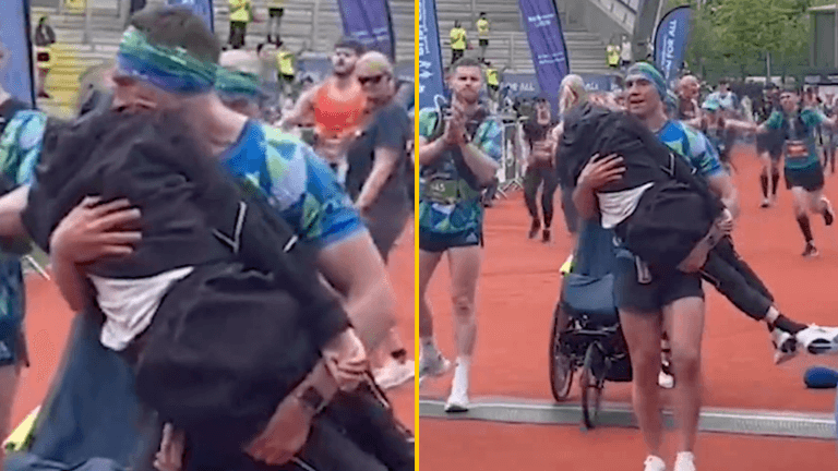 Heartwarming moment Kevin Sinfield lifts Rob Burrow from wheelchair and carries him over marathon finish line Heartwarming moment Kevin Sinfield lifts Rob Burrow from wheelchair and carries him over marathon finish line