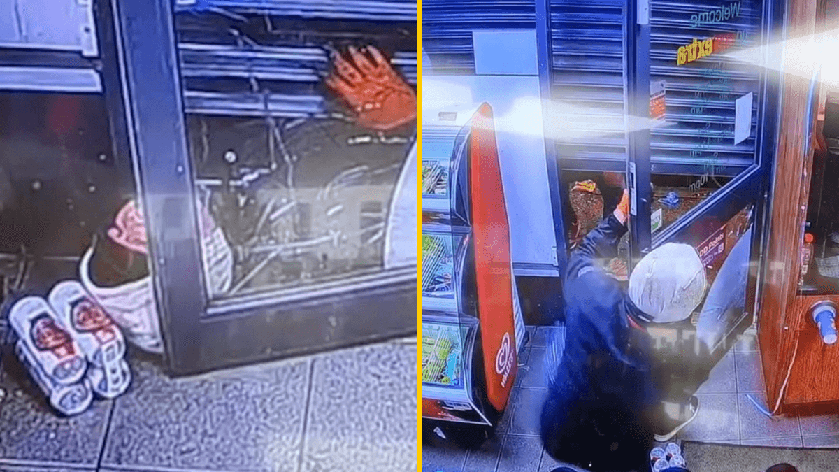 Hilarious moment armed robber gets trapped under shop’s roller shutters