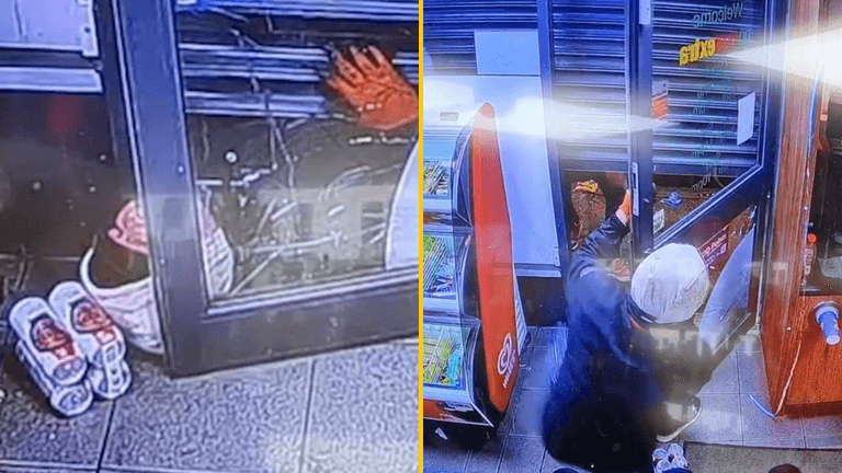 Hilarious moment armed robber gets trapped under shop’s roller shutters Hilarious moment armed robber gets trapped under shop’s roller shutters