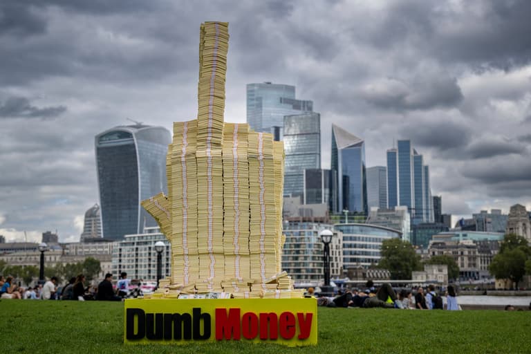 Middle finger made of dollars flips off richest one per cent to mark release of Dumb Money Middle finger made of dollars flips off richest one per cent to mark release of Dumb Money