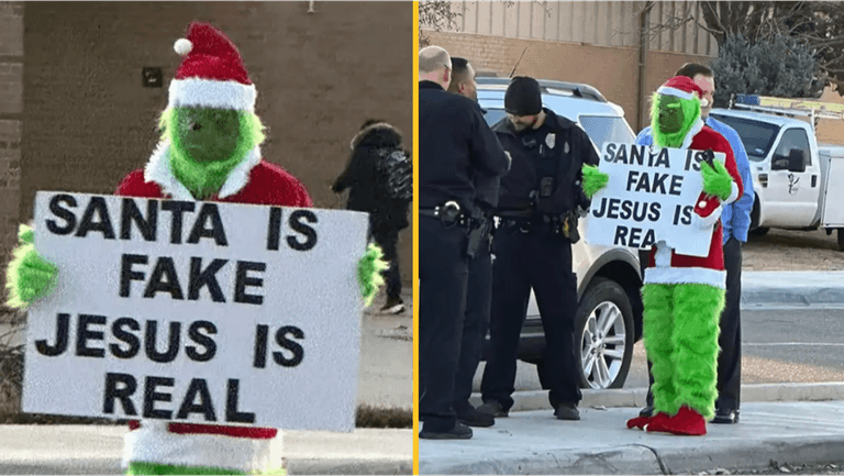 Grinch stands outside primary school with ‘Santa is fake’ sign Grinch stands outside primary school with ‘Santa is fake’ sign