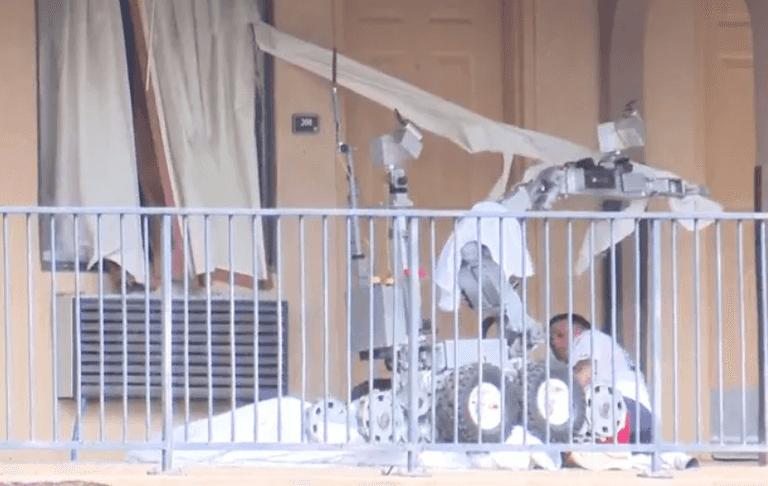The moment police robot tear-gasses man and runs him over The moment police robot tear-gasses man and runs him over