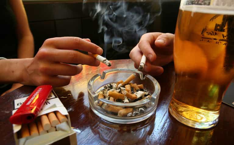 Government scrap planned ban on smoking outside pubs Government scrap planned ban on smoking outside pubs
