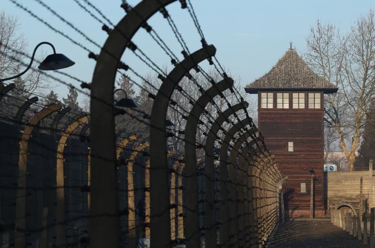 Students make neo-Nazi gesture on trip to Auschwitz and post picture online Students make neo-Nazi gesture on trip to Auschwitz and post picture online